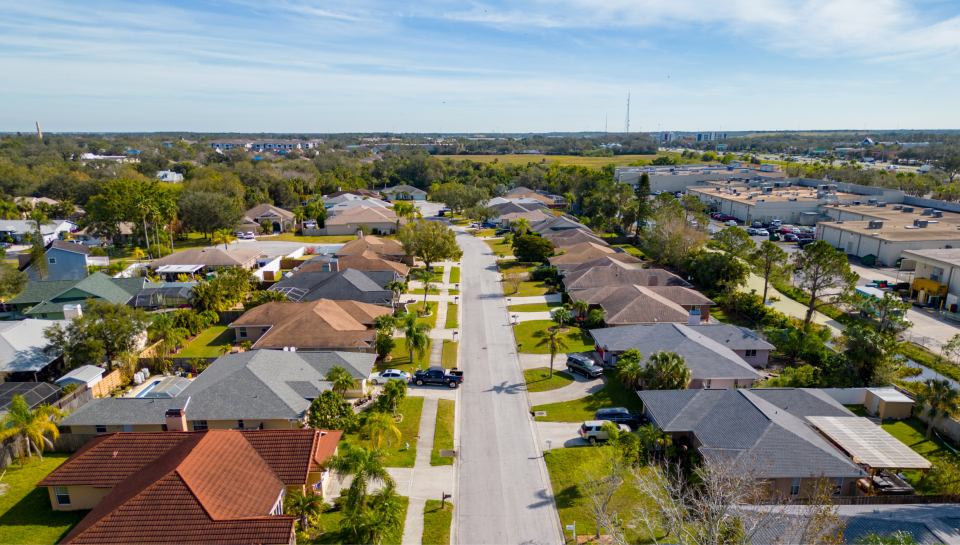 Suburban residential street in Toowoomba, Queensland, with homes and lush greenery.