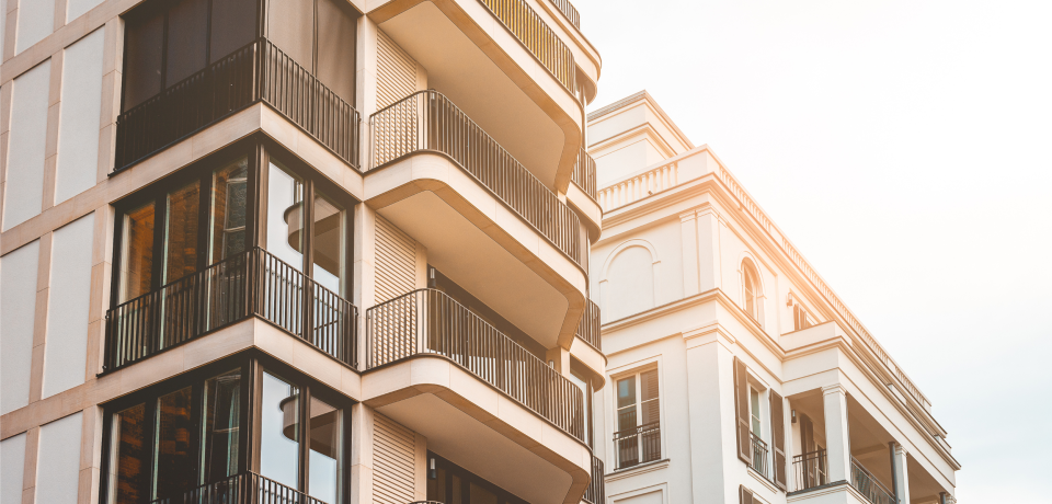 Modern apartment buildings in Toowoomba Queensland with glass balconies for property legal services.
