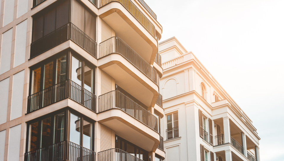 Modern apartment buildings in Toowoomba Queensland with glass balconies for property legal services.