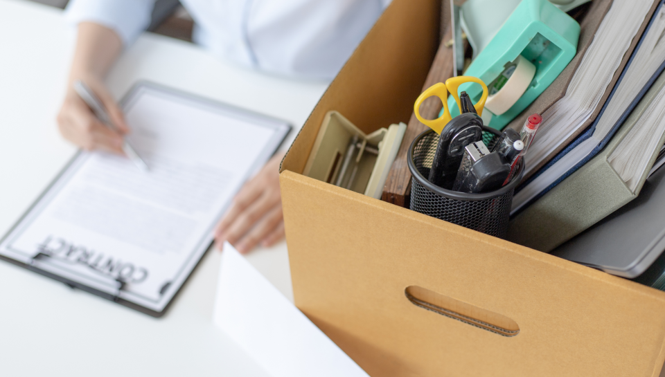 Office desk with legal documents, stationery, and a cardboard box, representing legal support in property, business, and civil law in Toowoomba.