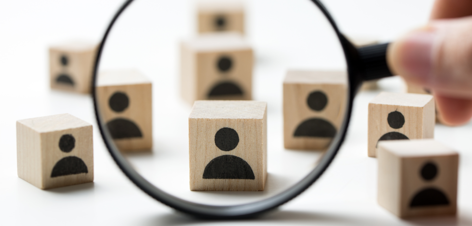 People concept with wooden blocks showing user icons, symbolising client focus and legal services.