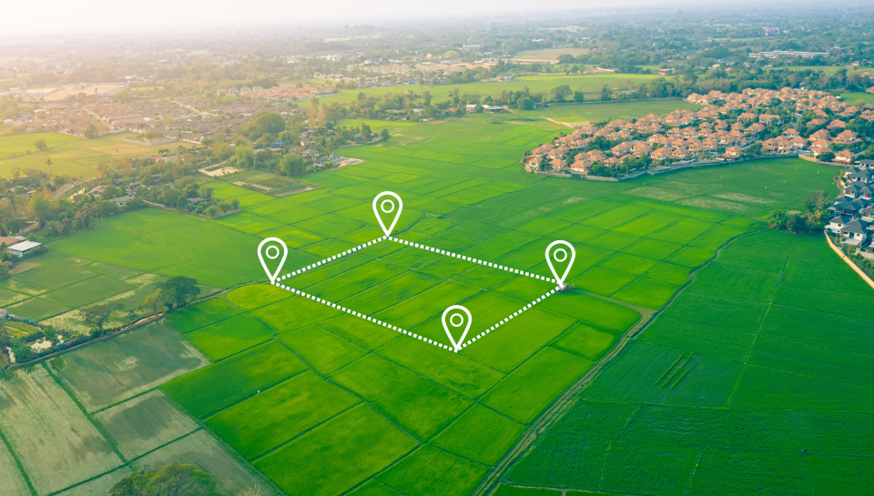 EL Explains What is Compulsory Aquisition Aerial view of Queensland farmland with property markers and dotted boundary lines.