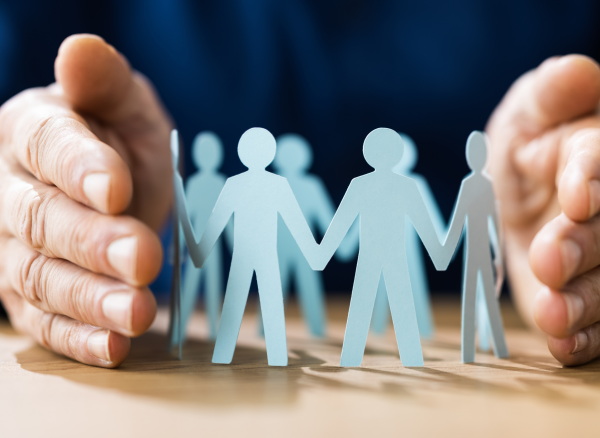 Diverse paper cutout figures representing community and teamwork in law practice.