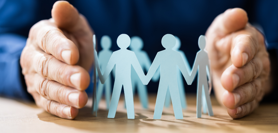 Diverse paper cutout figures representing community and teamwork in law practice.