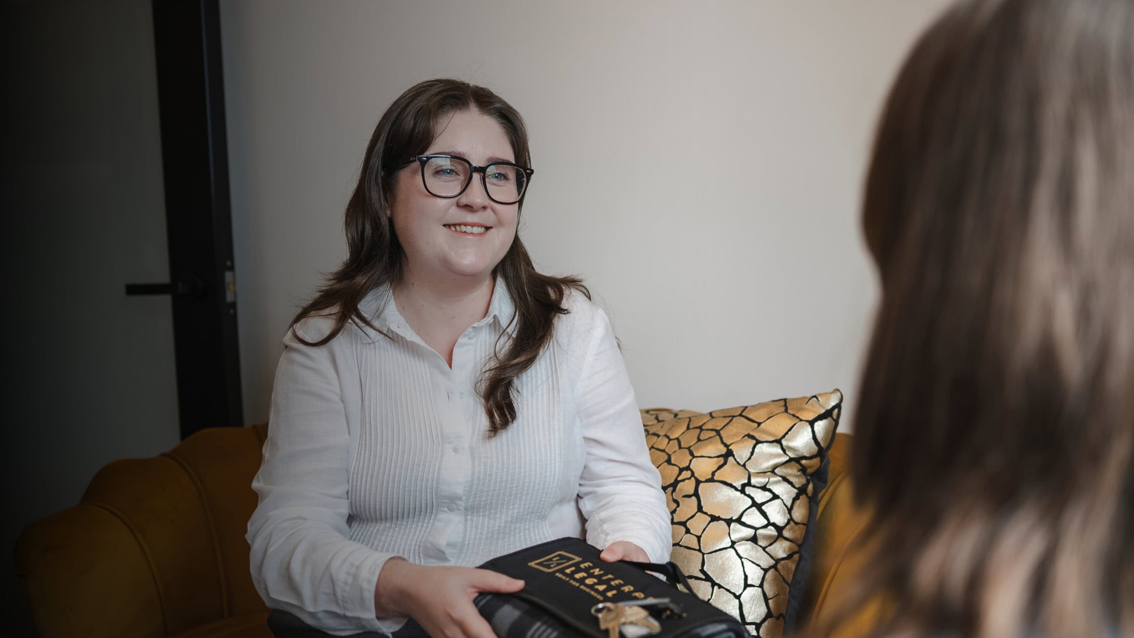 Professional woman providing legal advice in Toowoomba, Queensland, specialising in property, business, civil disputes, and construction law.