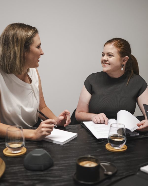 Professional women consulting on property and business law in Toowoomba, Queensland.