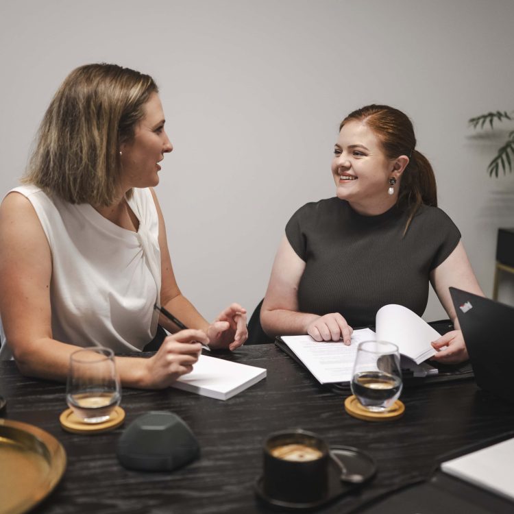 Professional women consulting on property and business law in Toowoomba, Queensland.