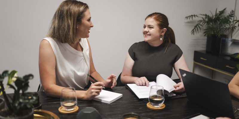 Professional women consulting on property and business law in Toowoomba, Queensland.