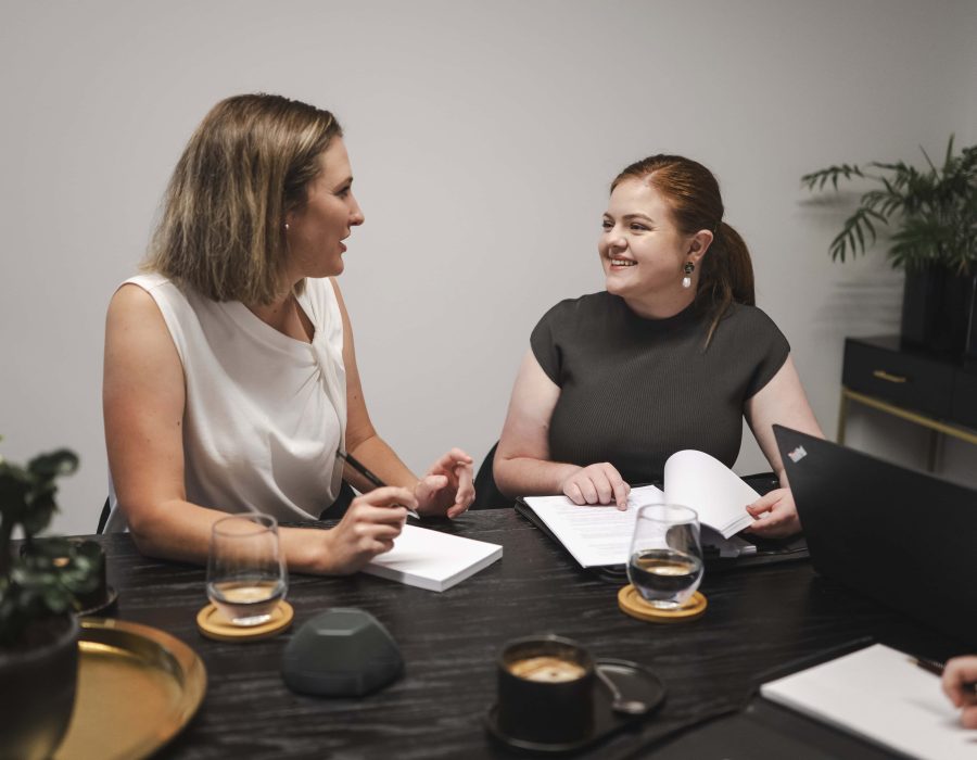 Professional women consulting on property and business law in Toowoomba, Queensland.