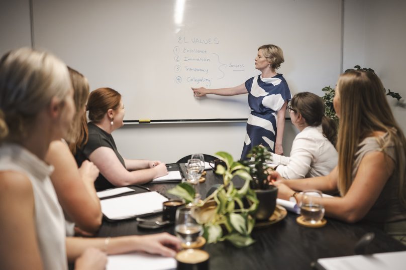 Professional women discussing legal strategies in a corporate meeting room in Toowoomba, Queensland.
