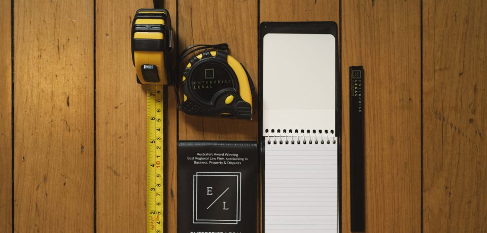 Yellow measuring tape and tool kit for property law in Toowoomba Queensland.
