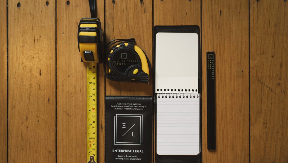 Yellow measuring tape and tool kit for property law in Toowoomba Queensland.