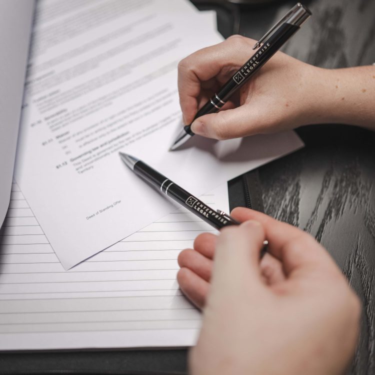 Legal documents being signed at a law firm in Toowoomba, Queensland.