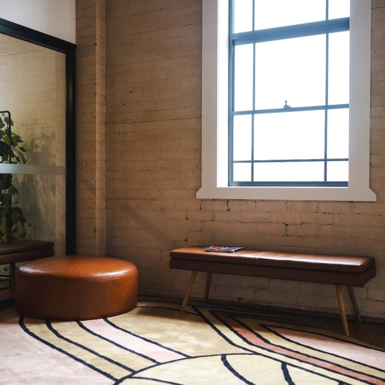 Modern law office interior with natural light, brick walls, and stylish furniture in Toowoomba, Queensland.