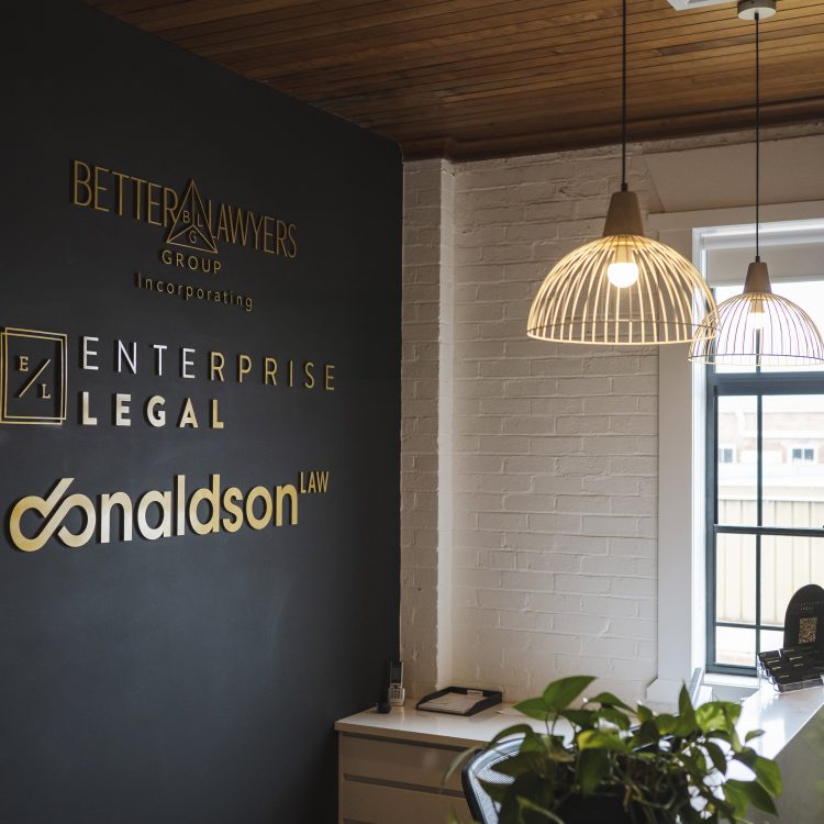 Modern law firm reception area in Toowoomba, Queensland, with property and business law signage.