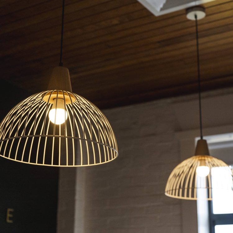 Bright modern pendant lights in stylish interior space, featuring warm lighting and contemporary design.