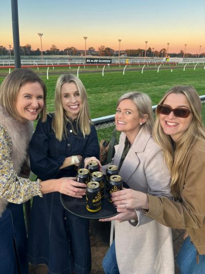Friends enjoying drinks at a racecourse in Toowoomba Queensland.