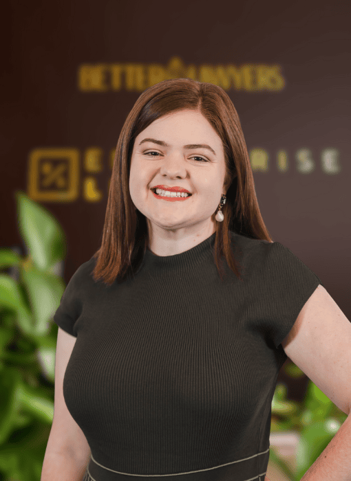 Professional woman smiling in Toowoomba law firm office, legal services Queensland.