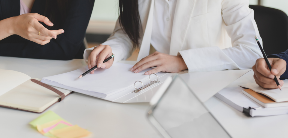 Legal team discussing property law cases in Toowoomba law firm.