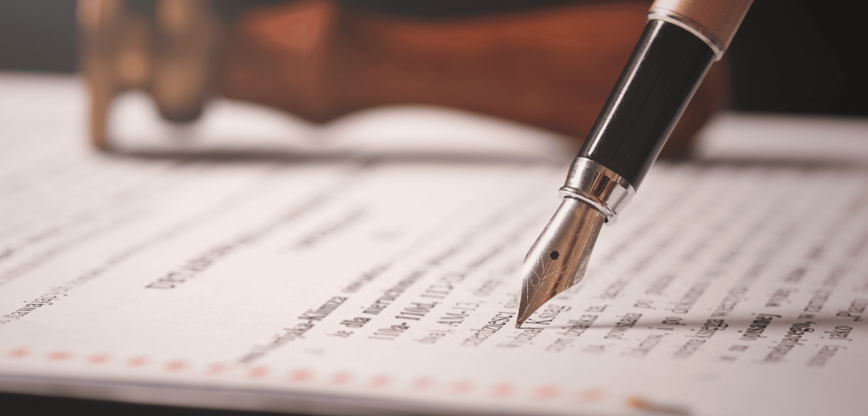 Close-up of a fountain pen on legal document, law firm in Toowoomba Queensland, property and civil dispute legal services.